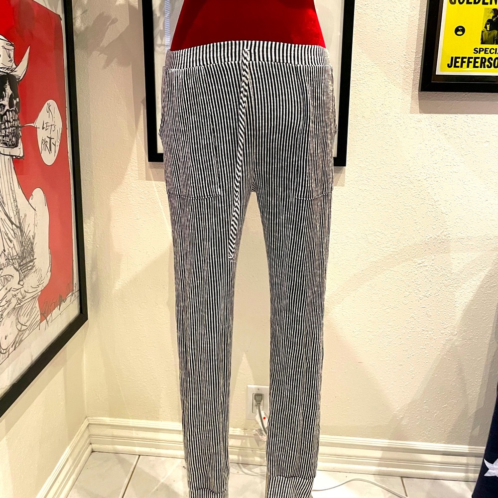 Caution to the wind. Black and white pants